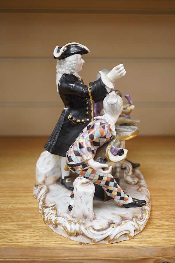 A 19th century Meissen group of The Dentist, outside decorated, incised model no. 186, 21cm. Condition - broken and restored